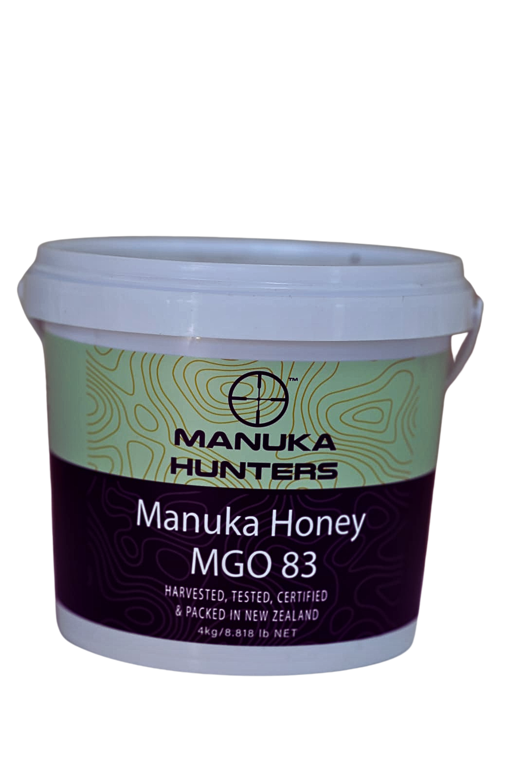A plastic tub of Manuka Honey MGO 83 by Manuka Hunters, with a green and white label, placed against a plain background.