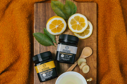2 manuka hunters honey jars, with lemon slices and ginger