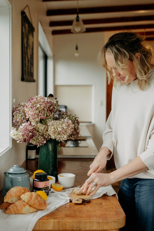 making a healthy breakfast with bread and manuka honey