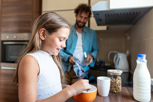 young girl preparing breakfast in kitchen